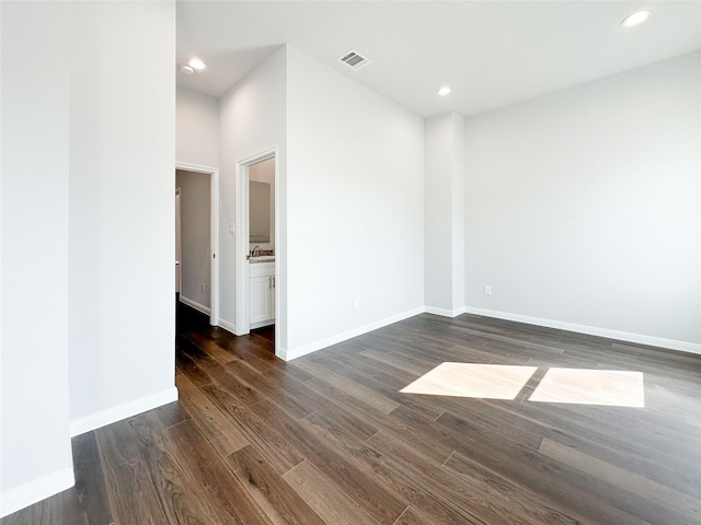 spare room with dark hardwood / wood-style floors