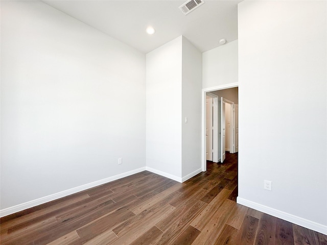 unfurnished room featuring dark hardwood / wood-style floors