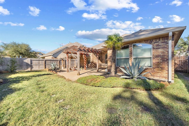 back of house with a yard, a pergola, and a patio