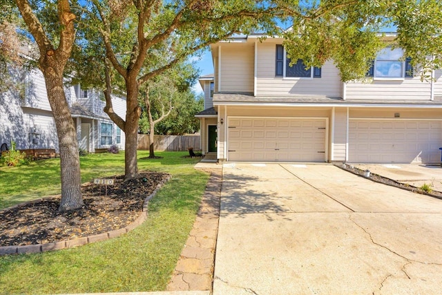 view of front of house with a garage and a front yard