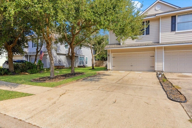 view of front facade featuring a garage and a front yard