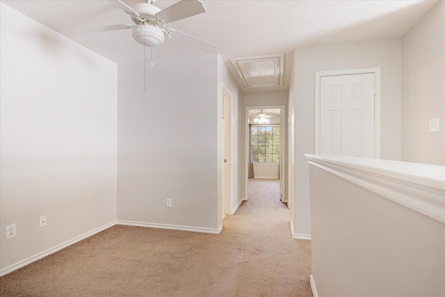 empty room with light carpet and ceiling fan