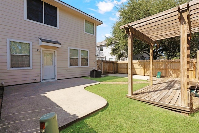 view of yard featuring a wooden deck, a pergola, a patio, and central AC unit