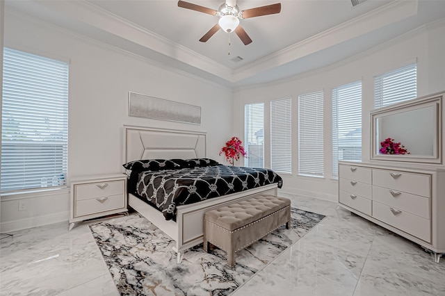 bedroom featuring crown molding, ceiling fan, a raised ceiling, and multiple windows