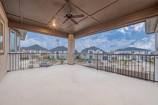 view of patio featuring a balcony and ceiling fan