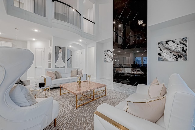 living room with a towering ceiling