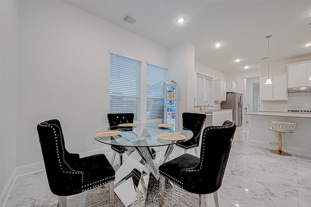 dining room featuring sink