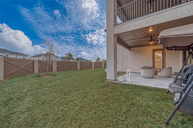 view of yard with a balcony and a patio area