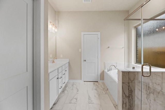 bathroom with vanity and separate shower and tub