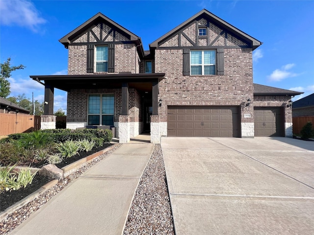 view of front of property with a porch and a garage