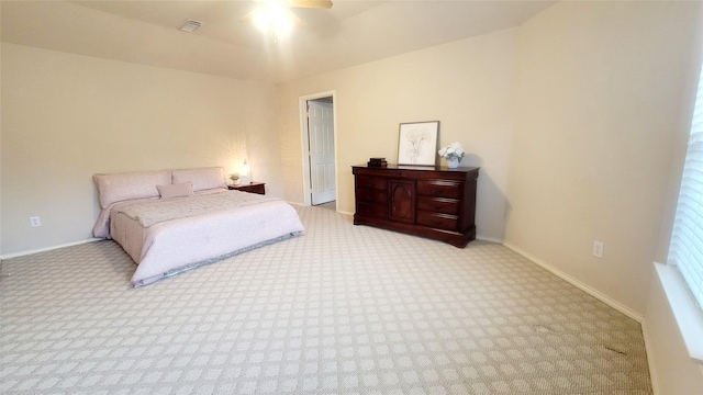 bedroom featuring light colored carpet