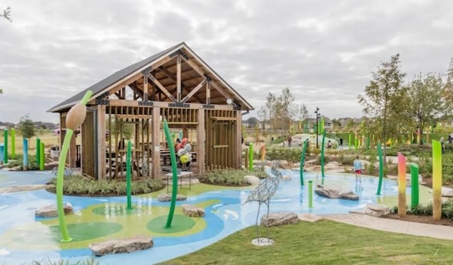 view of property's community with a playground