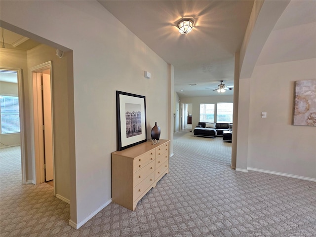 hallway with light colored carpet