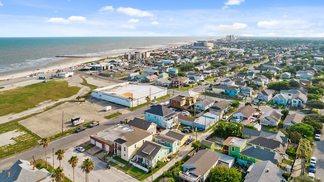 bird's eye view featuring a water view and a view of the beach