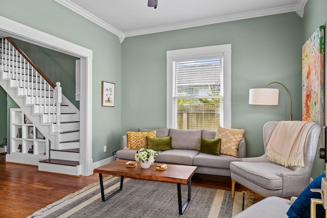 living room with ornamental molding and dark hardwood / wood-style floors