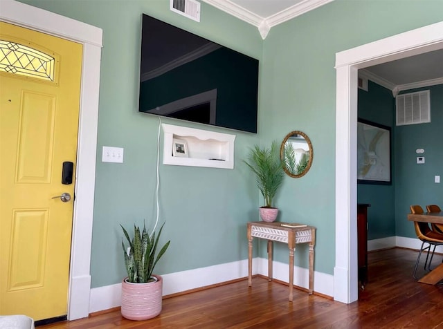 interior space featuring crown molding and dark hardwood / wood-style flooring