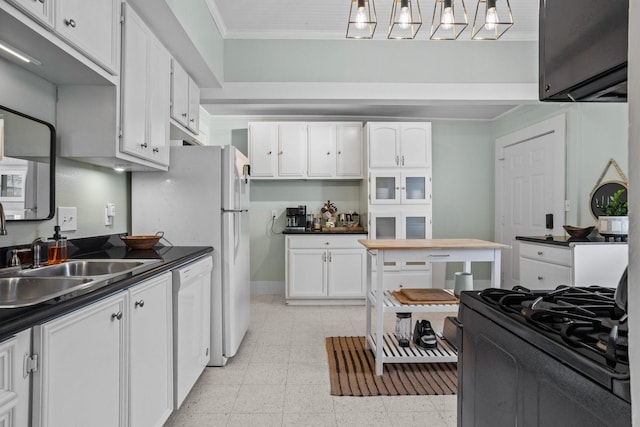 kitchen with white cabinetry, white dishwasher, sink, and crown molding