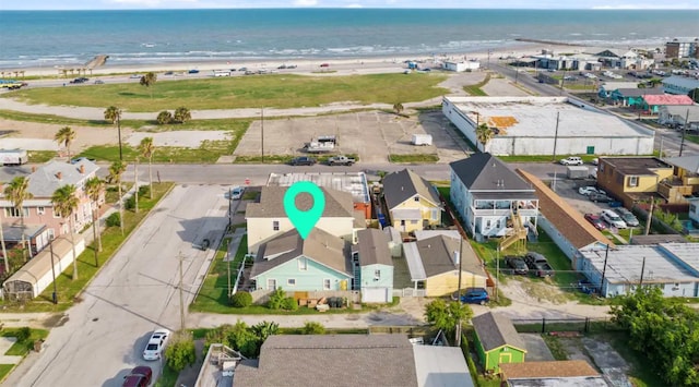 bird's eye view featuring a water view and a view of the beach