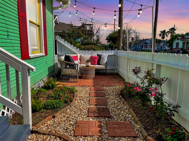 patio terrace at dusk with an outdoor hangout area