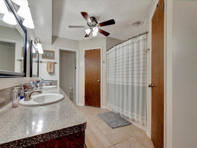 4 Rain Drop Dr, Lufkin, TX 75901 - bathroom featuring vanity, tile patterned floors, a textured ceiling, a ceiling fan, and curtained shower