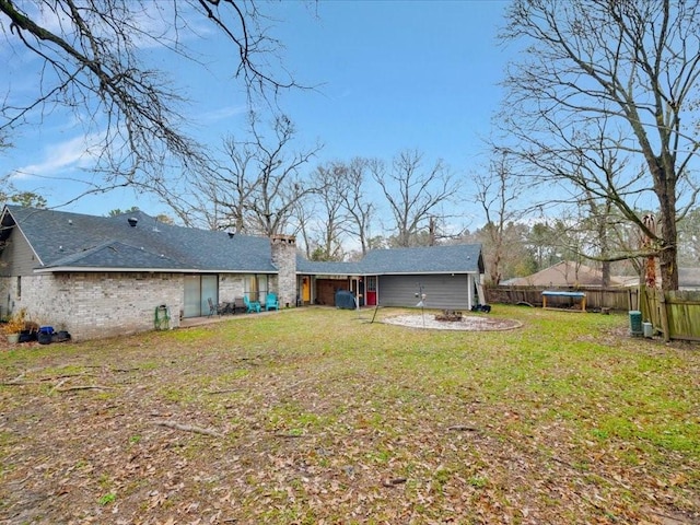 4 Rain Drop Dr, Lufkin, TX 75901 - rear view of property featuring a chimney and a trampoline
