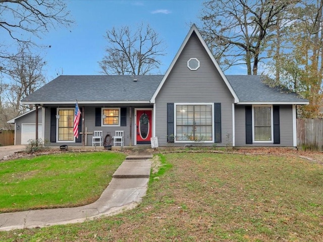 view of front of property featuring a garage and a front yard