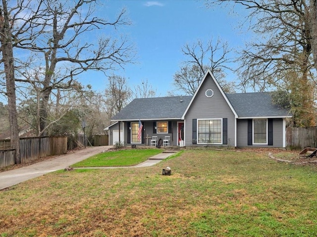 view of front of house with a garage and a front lawn