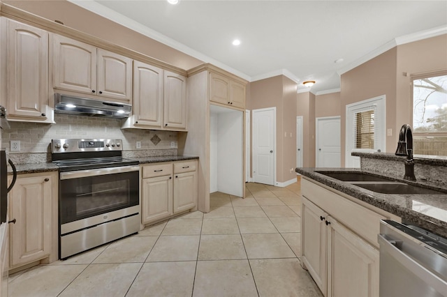 kitchen with stainless steel appliances, crown molding, sink, and dark stone counters