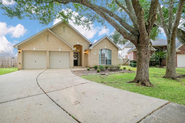 view of front facade with a garage and a front yard