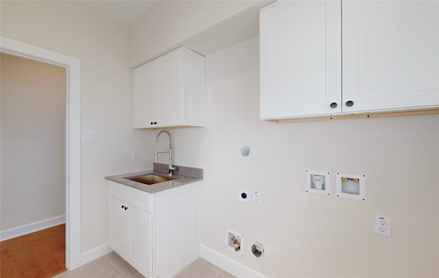 laundry area with sink, hookup for a gas dryer, cabinets, hookup for a washing machine, and hookup for an electric dryer