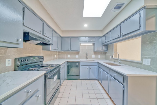 kitchen featuring sink, gray cabinetry, and black appliances