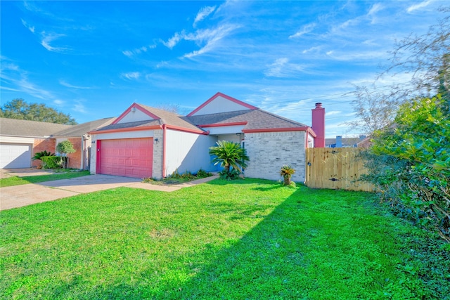 view of front facade with a garage and a front lawn