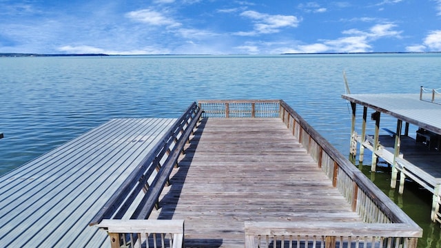 view of dock with a water view