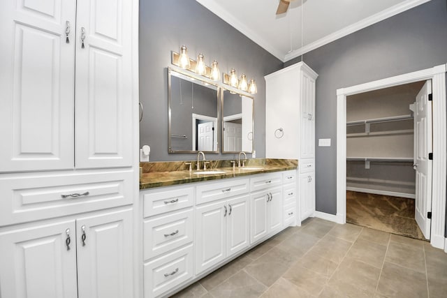 bathroom featuring ceiling fan, tile patterned flooring, vanity, and ornamental molding