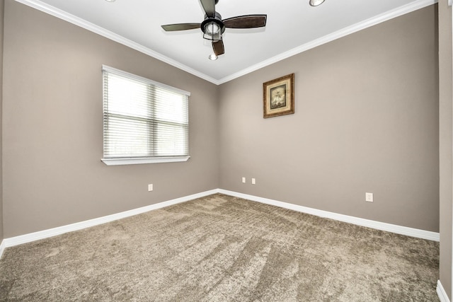 carpeted spare room with crown molding and ceiling fan