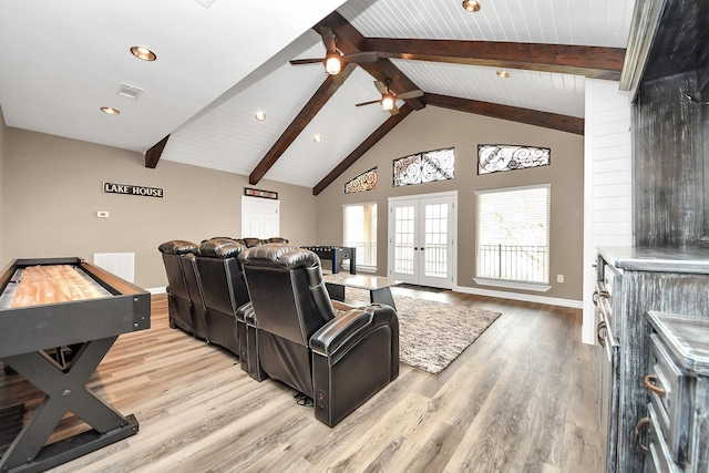 living room featuring beamed ceiling, hardwood / wood-style floors, high vaulted ceiling, and french doors