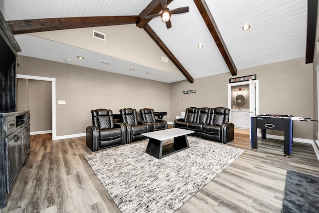 living room featuring high vaulted ceiling, beam ceiling, and light hardwood / wood-style floors