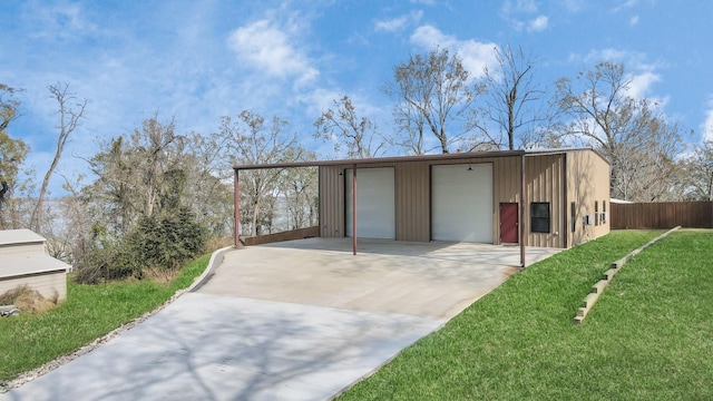 view of outdoor structure featuring a garage and a yard