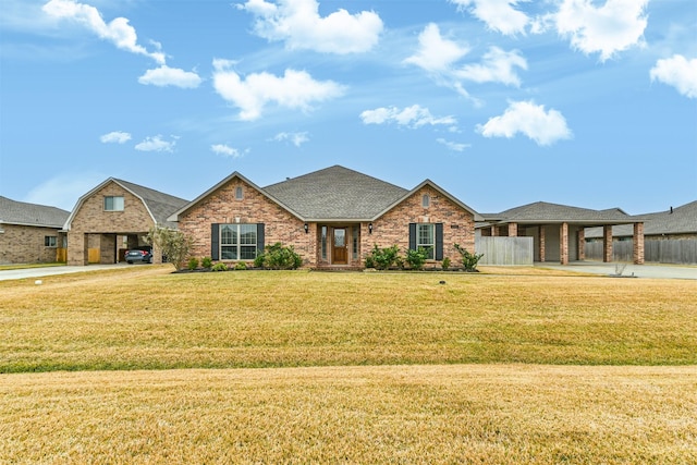 view of front facade with a carport and a front lawn