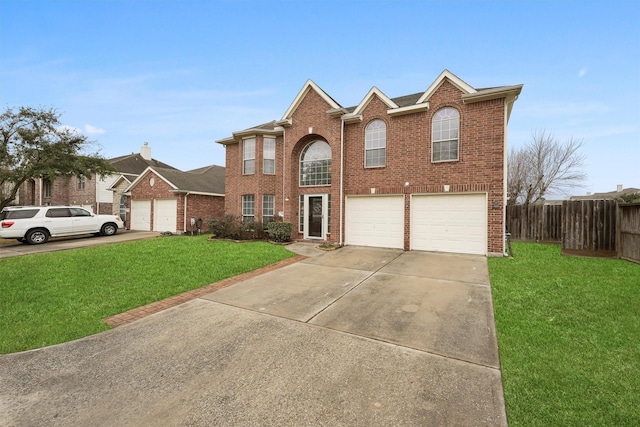 view of property with a garage and a front yard