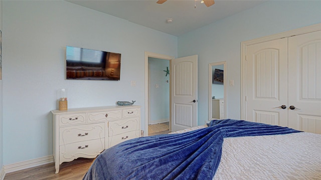 bedroom featuring a closet, ceiling fan, baseboards, and wood finished floors