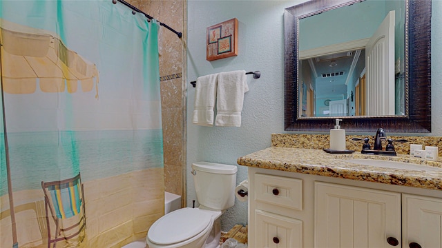 bathroom featuring visible vents, a textured wall, toilet, shower / tub combo, and vanity