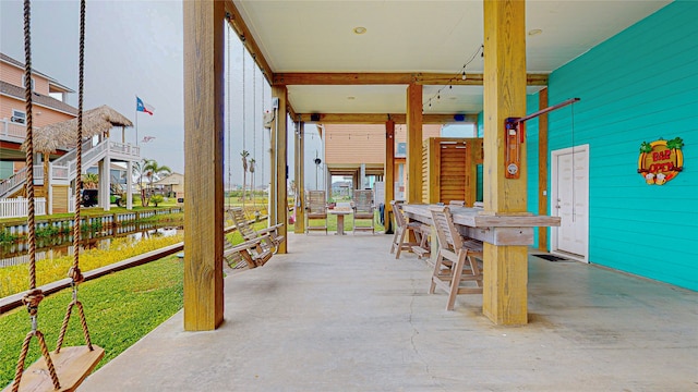 view of patio with a bar