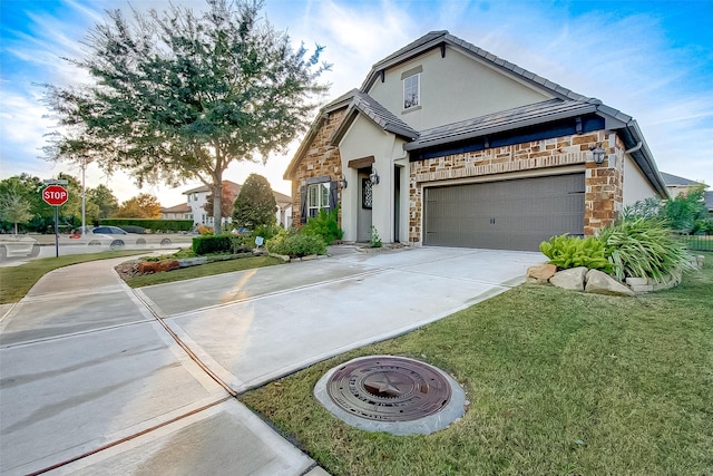 view of front of house featuring a garage and a front yard