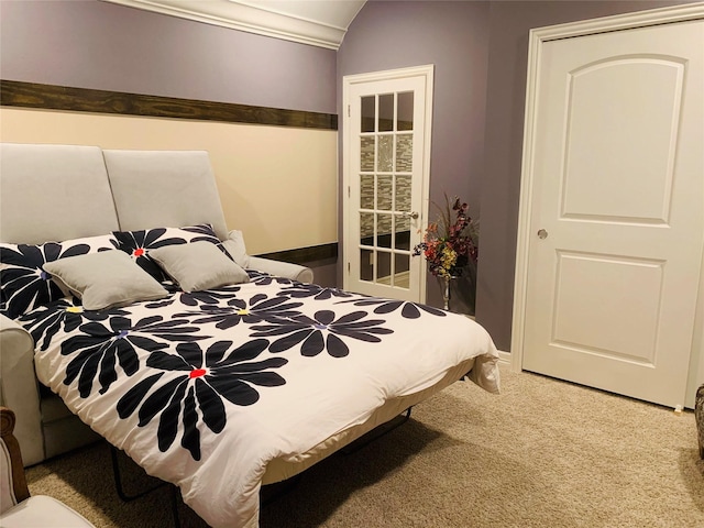 bedroom featuring lofted ceiling and carpet floors