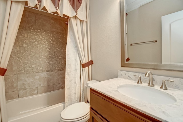 full bath with shower / bath combo, vanity, and toilet