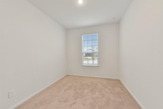 empty room featuring light carpet