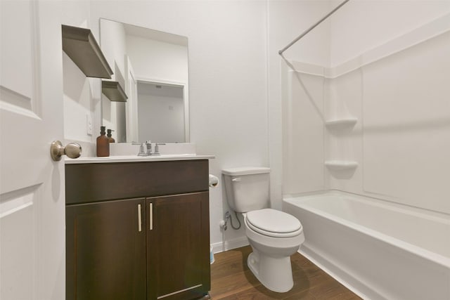 full bathroom with wood-type flooring, vanity, shower / bathtub combination, and toilet