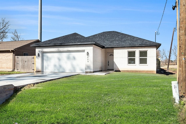 view of front of home featuring a garage and a front lawn