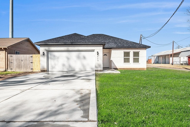 view of front of house with a garage and a front yard